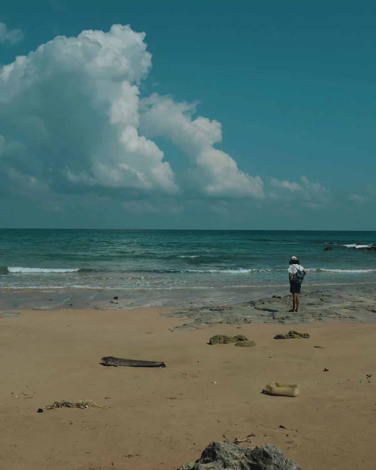 A quiet beach in the Andaman islands, a cloud rising over the sea