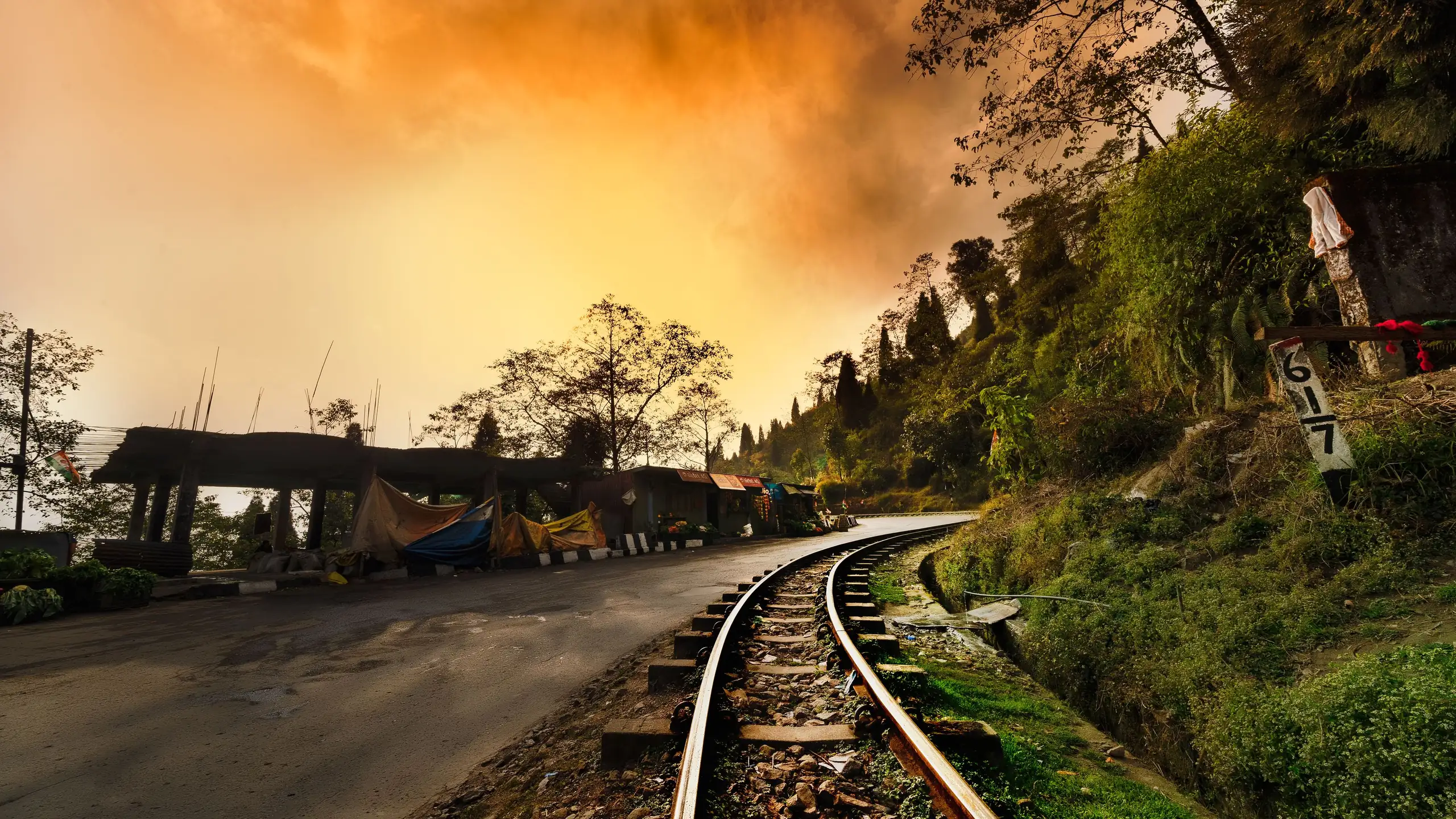 The narrow-gauge railway line at Darjeeling under an evening sky