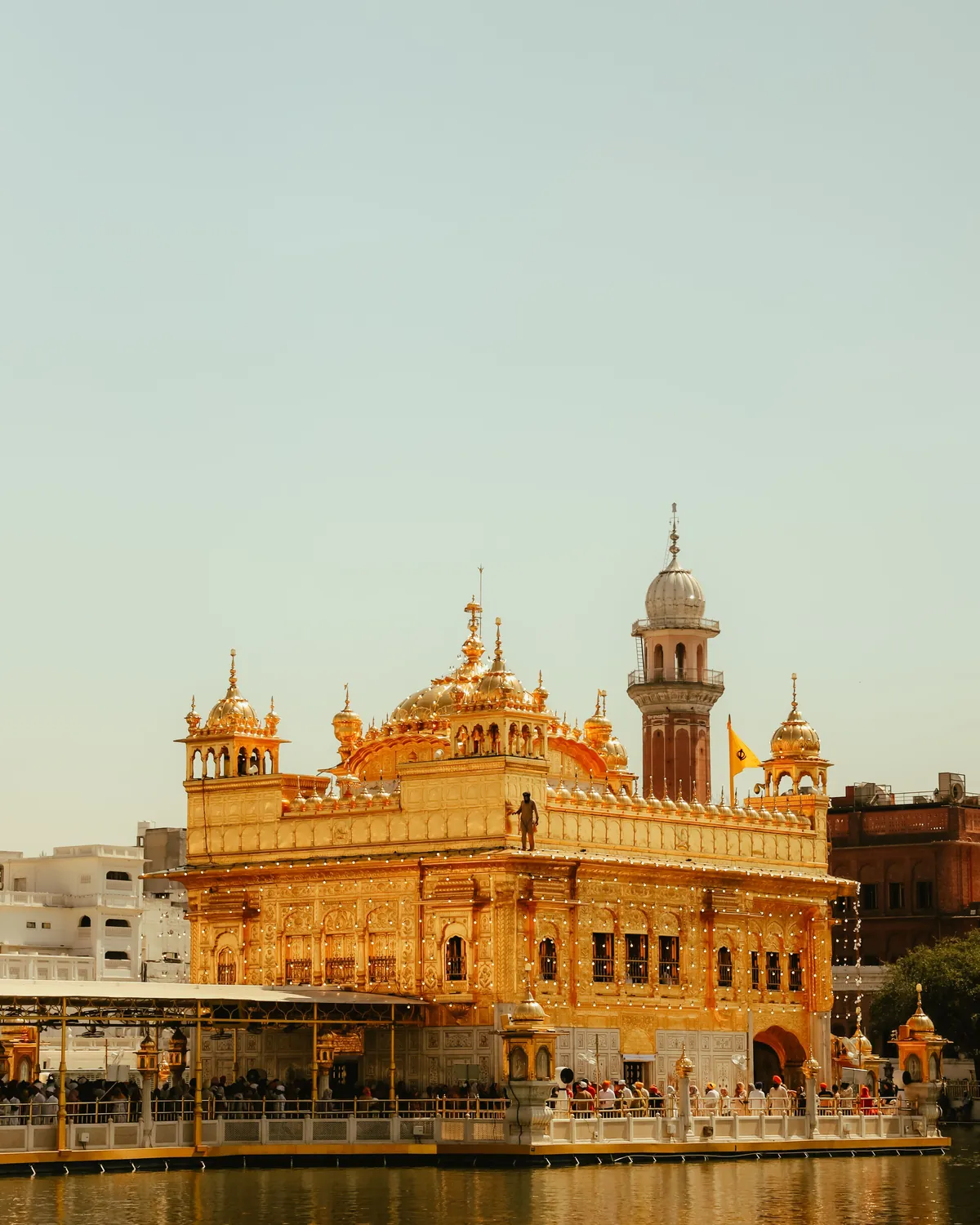 The Golden Temple at Amritsar in evening light, reflected in the pool